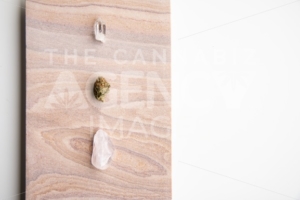 Marijuana Bud and Crystals on a Desert Stone, Close Up – Minimalist Cannabis - The Cannabiz Agency