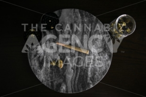 Marijuana Joint, Buds and Grinder on Dark Marble Luxury Cannabis - The Cannabiz Agency