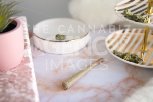 Marijuana Joint and Buds on Pink Marble Vanity Luxury Cannabis - The Cannabiz Agency