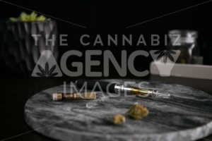 Marijuana Vape Pen, Concentrate and Buds on Dark Marble Luxury Cannabis - The Cannabiz Agency
