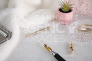 Marijuana Vape Pen with Concentrate and Joint on White Marble Luxury Cannabis - The Cannabiz Agency