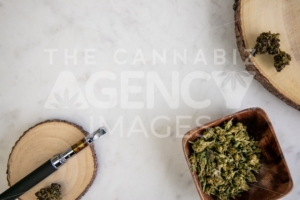 Top Down View of Vape Pen, Shake, Marijuana Buds on Wood – Cannabis Dispensary Products - The Cannabiz Agency