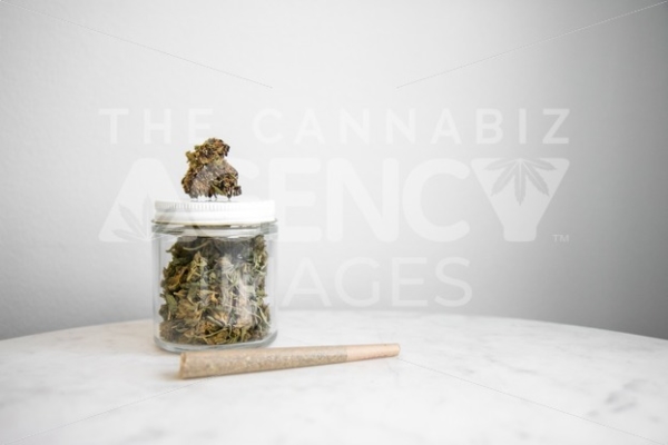 TCA Images jar of weed on marble table