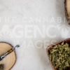 Pen, Flower and Reclaimed Wood Accessories on White Marble – Top Down - Cannabis Royalty Free Stock Images