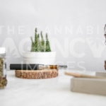 Products on Wooden Tray, Flower, and Cactus – Pen In Focus - Cannabis Royalty Free Stock Images