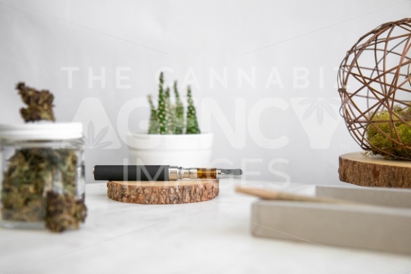 Products on Wooden Tray, Flower, and Cactus – Pen In Focus - Cannabis Royalty Free Stock Images