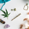 Summer Festival Essentials Blue Bikini and Gold on White – Top Down - Cannabis Royalty Free Stock Images